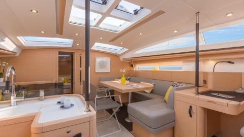 Jeanneau 58 : Saloon and charts table seen from the galley Jeanneau 58 : Saloon and charts table seen from the galley