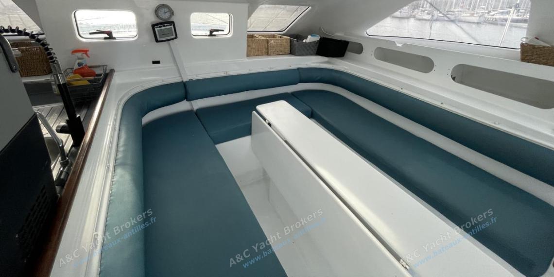 Multicap-Caraïbes Punch 12,50 : Saloon table and bench other view Multicap-Caraïbes Punch 12,50 : Saloon table and bench other view